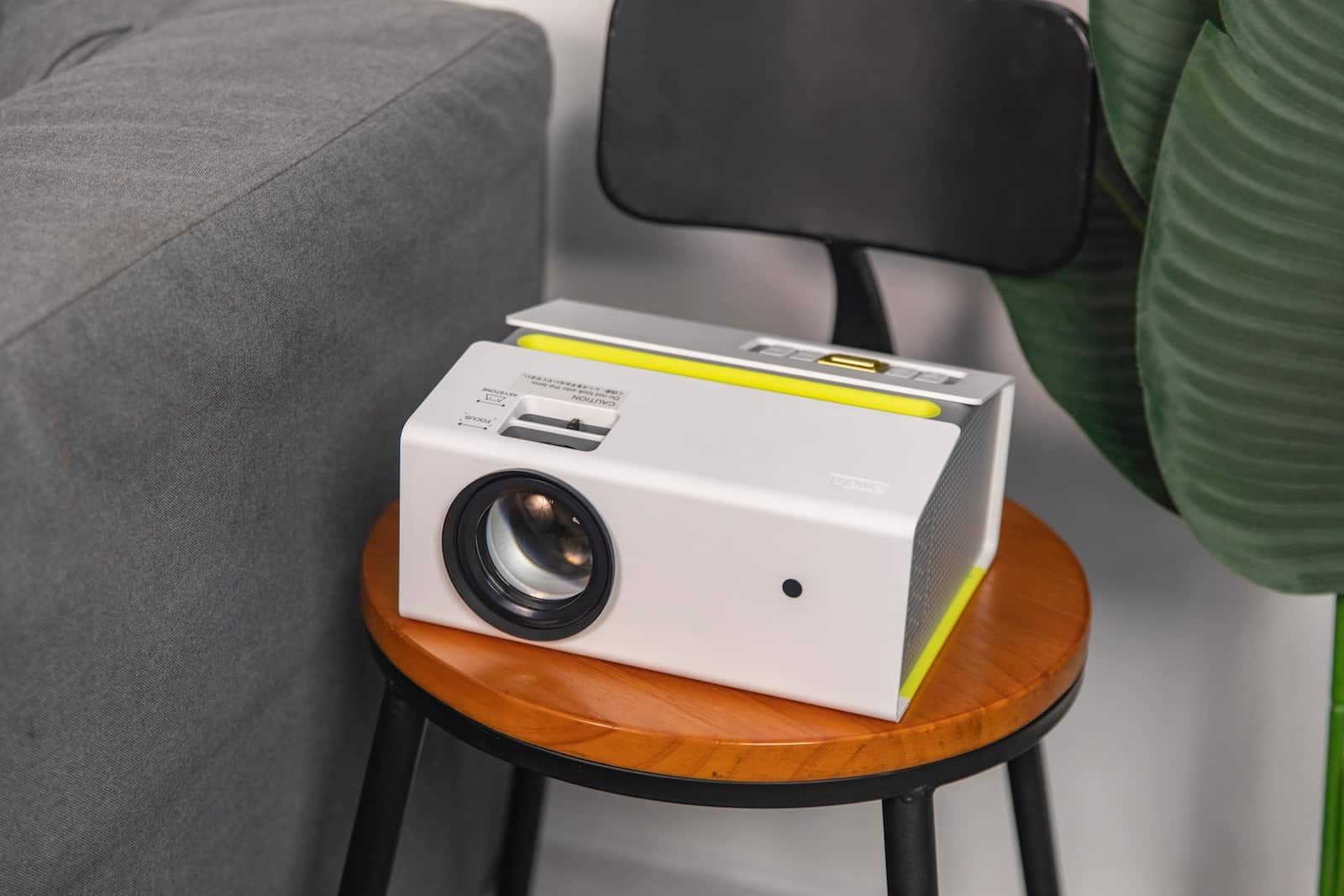a white projector sitting on top of a wooden table